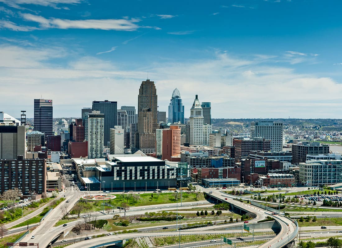 Cincinnati, OH - Aerial View of Buildings in Downtown Cincinnati Ohio Against a Bright Blue Sky