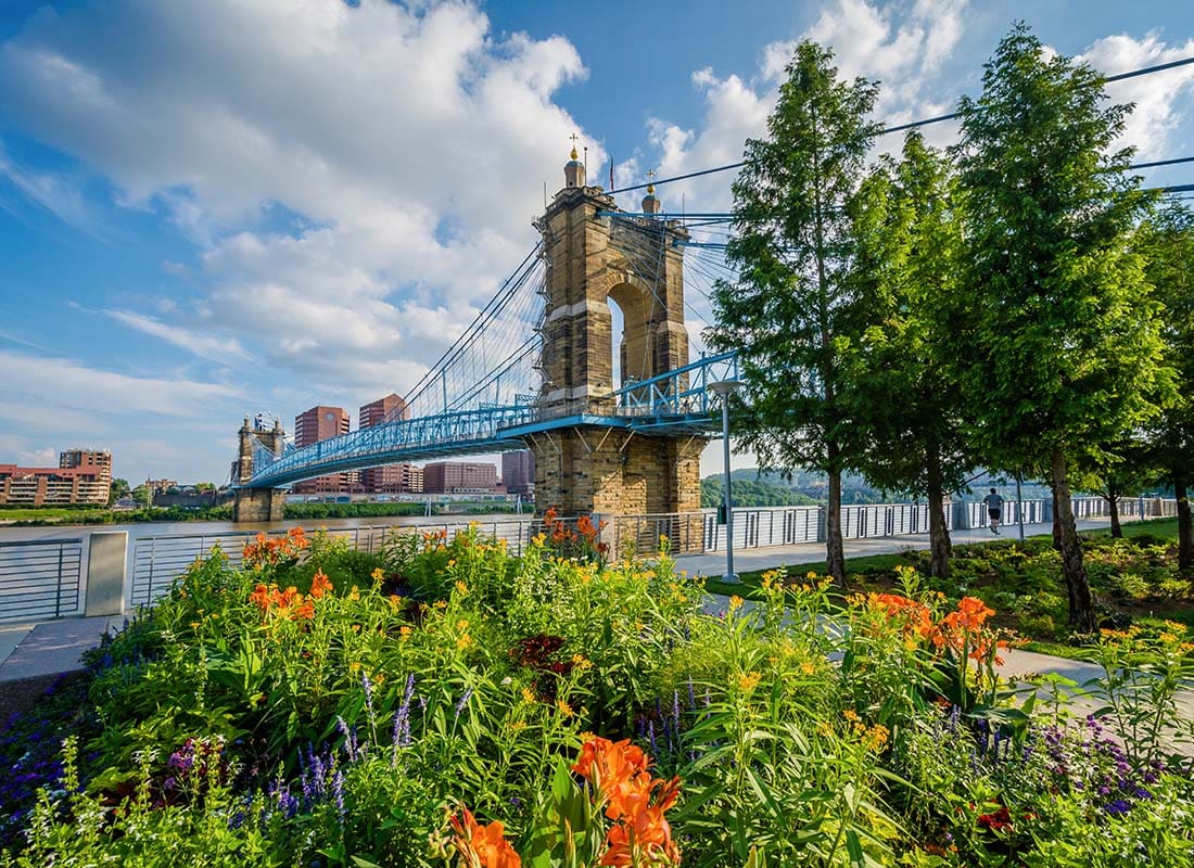 We Are Independent - Scenic View of Flowers Blooming Next to a Bridge in Downtown Cincinnati Ohio on a Beautiful Sunny Day